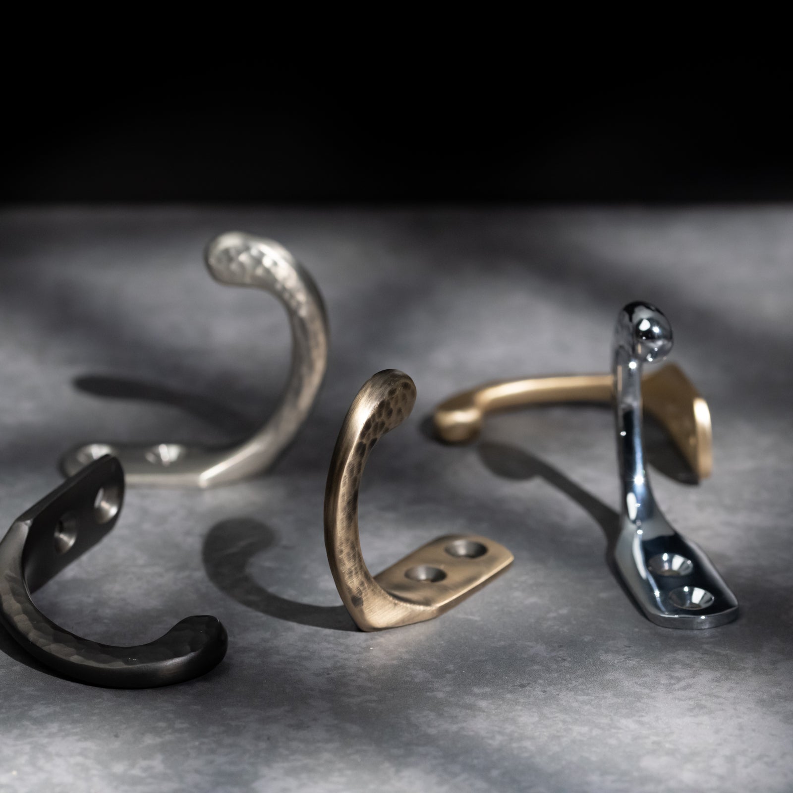 Hammered single robe hook in antique brass