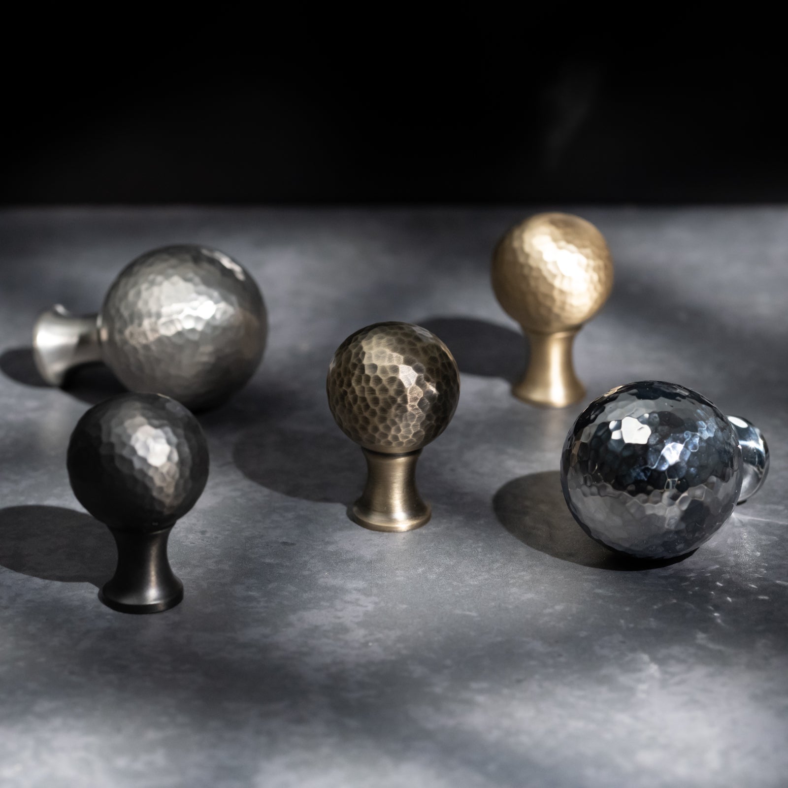 Hammered ball cabinet knob in antique brass 