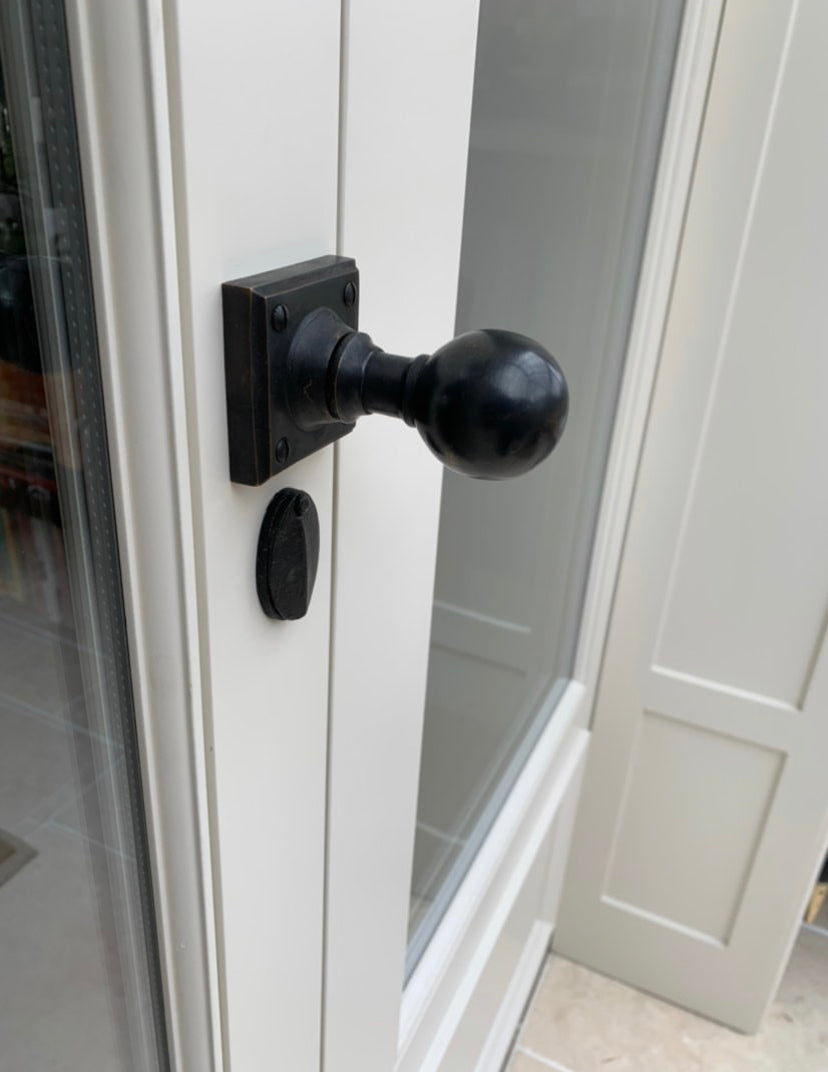 Door with round bronze door knob SHOW